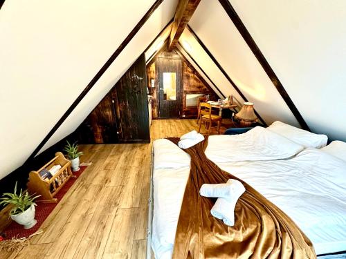 a bedroom with a bed and a room with a table at Fjord Panorama Lodge in Strand