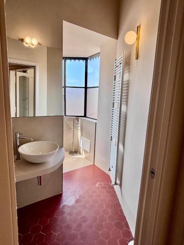 a bathroom with a tub and a sink and a mirror at Augusta e Libero Apartments in Spoleto