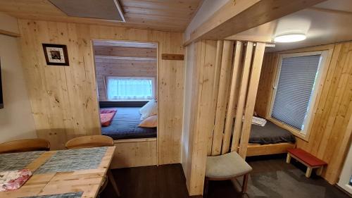 En eller flere senge i et værelse på Hütte 28