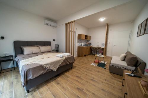 a bedroom with a large bed and a couch at Wine House Churilo in Ohrid