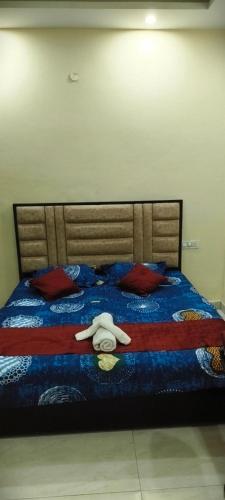 a bed with a stuffed animal laying on it at The duggar villa in Jammu