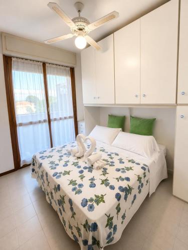 a bedroom with a bed with two towels on it at Residence The Yellow Fish with Pool in Manerba del Garda
