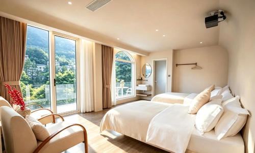 a bedroom with two beds and a large window at Book NOW & Chat, Wake in Mountain,Free Shuttle,Aside National Park, Combo Stay in Tianmen city center, English Speaking Assistant in Jiawan