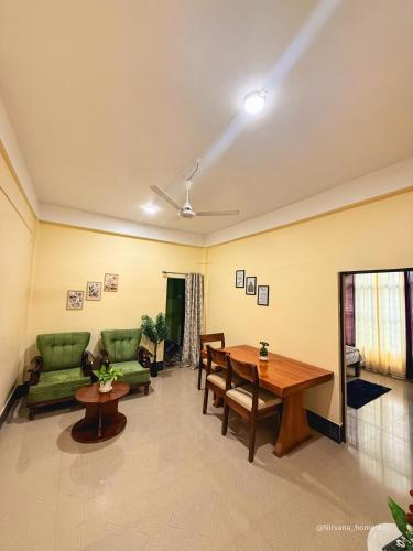a living room with a couch and a table at Nirvana homes in North Lakhimpur