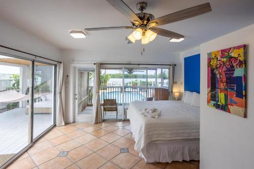 a bedroom with a bed and a ceiling fan at Turtle Beach Resort in Siesta Key