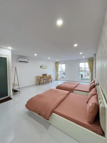 a large bedroom with a large bed in a room at Hạt Nắng House - Gò Vấp in Ho Chi Minh City