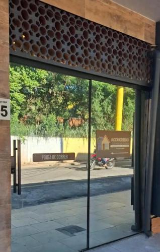 a view of the entrance to the church of scientology from inside the building at Loft Essence in Volta Redonda