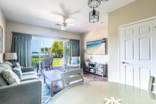 a living room with a glass table at Blue House Getaway - 2BR 3BA Coastal Villa in Duck Key