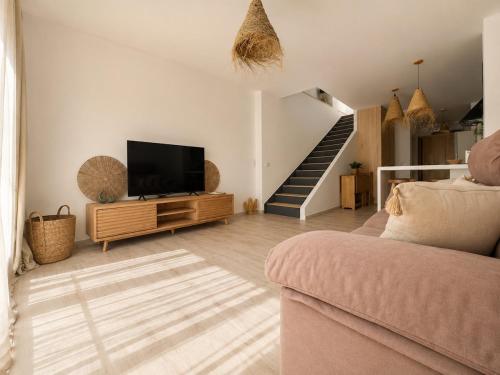 Duplex with private terrace next to the beach