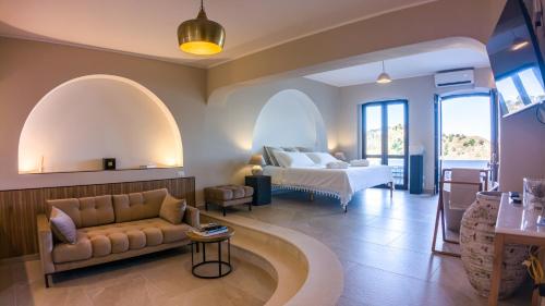a living room with a couch and a bed at Porta di Savoca in Savoca