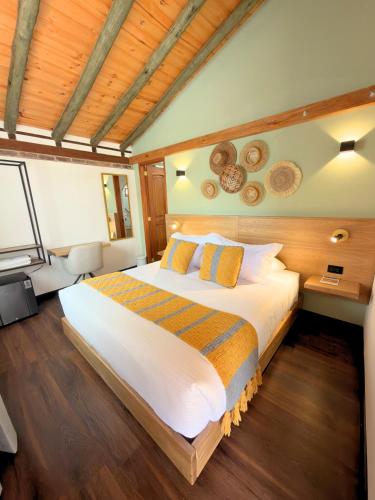 a bedroom with a large bed in a room at Casa Sie in Villa de Leyva