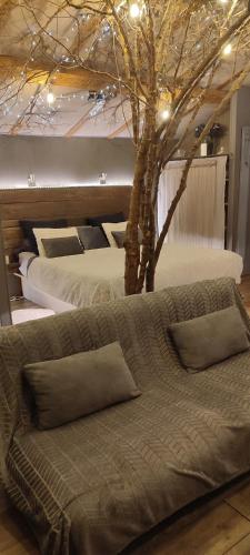 a bedroom with two beds with trees and lights at Lyon Campagne in Rontalon