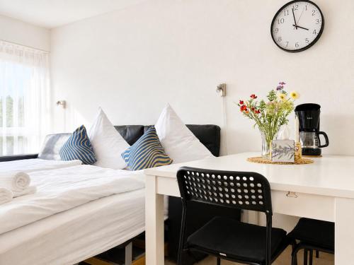 a room with a desk and a bed with pillows at Thermenblick in Bad Rodach