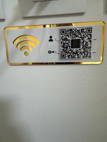 a refrigerator with a wifi sign on the side of it at Il Ligustro by Roberto in San Giovanni Lupatoto