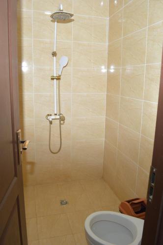a bathroom with a shower with a toilet in it at Hostel East Star Khiva in Khiva