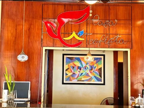 a sign above the door of a restaurant at Hotel Casa Teofista in Panglao Island
