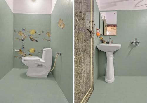 a bathroom with a toilet and a sink at Hotel Avira Inn-Opp Lucknow HighCourt in Lucknow