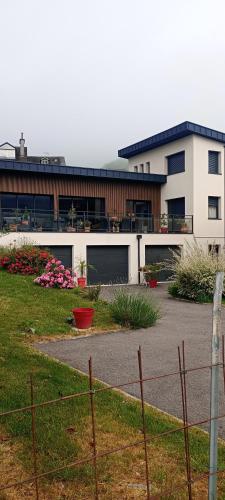 a large white building with a lot of windows at Chambre chez sylvie in Laruns