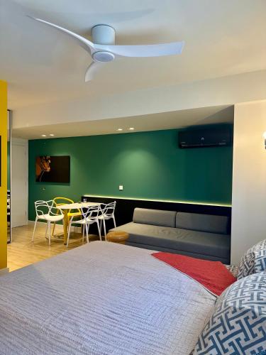 a bedroom with a bed and a table and chairs at Samothraki Belize Luxury Apartments in Samothraki