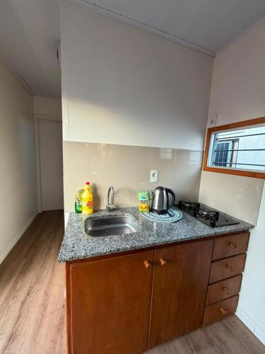 a kitchen with a sink and a counter top at My Ideal in Balneario Argentino