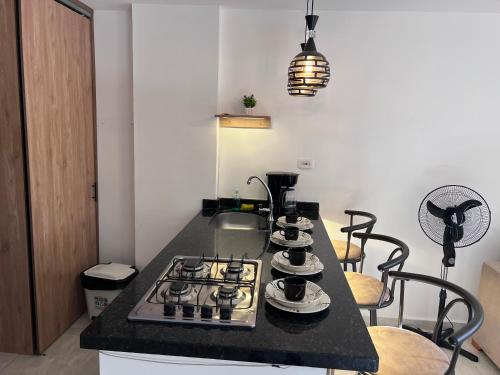a kitchen with a stove and a counter top at Refugio Tenerife San Gil in San Gil