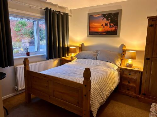 a bedroom with a bed and a window at Peaceful Coastal Escape in Old Colwyn