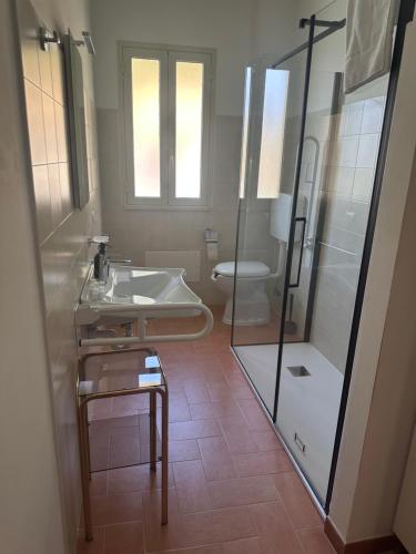 a bathroom with a sink and a toilet at Villa Luca e Vale in Graniti