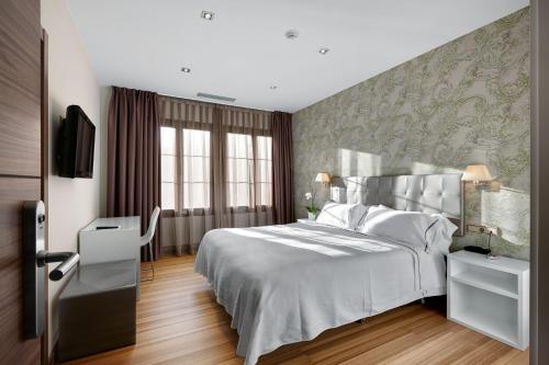 Кровать или кровати в номере Atalaia