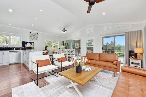 a living room with a couch and a table at Lamp Estate in Greta