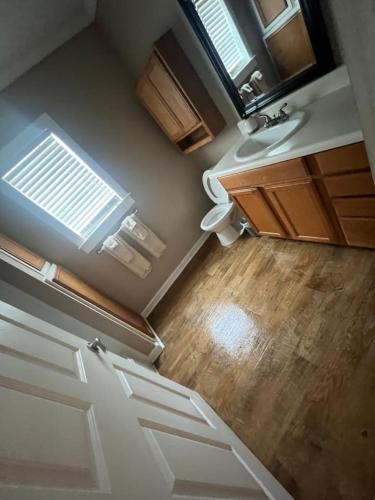 an empty bathroom with a sink and a toilet at Red Leaf Cottages in Lake Village