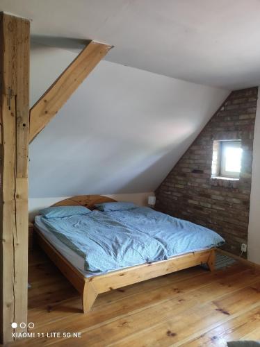 a bedroom with a bed in a attic at Storchenhorst 