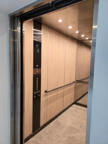 a walk in closet with wooden lockers in a building at City View Luxe Condo in Mandeville