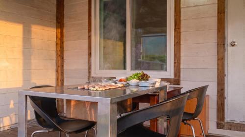 a table with a plate of food on it at Gapyeong ebenzer Pension in Gapyeong