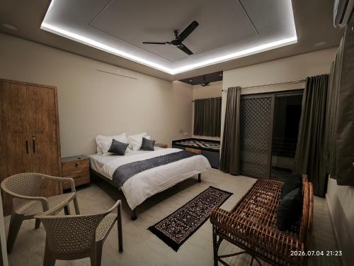 a bedroom with a bed and a ceiling at Aeronest Villa "your new escape" in Udaipur