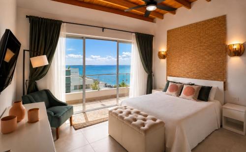 a bedroom with a bed and a view of the ocean at Luxurious Ocean View Penthouse in Boca Chica