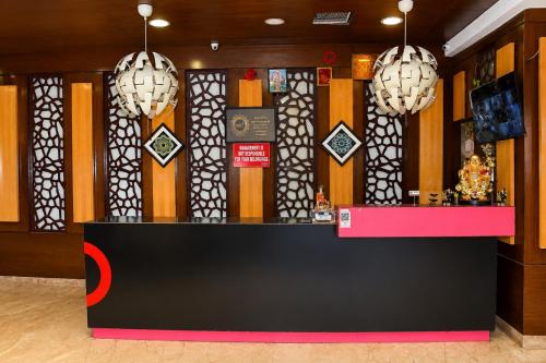a store front with a pink and black counter at Hotel Sree7 Inn in George Town