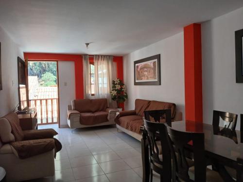 a living room with a couch and a table at La Posada del Inca Chavin in Chavín de Huantar