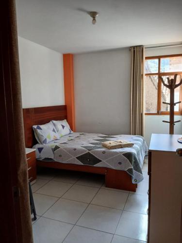 a bedroom with a bed and a window at La Posada del Inca Chavin in Chavín de Huantar