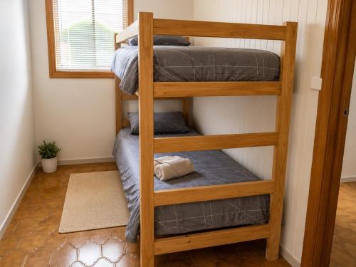 a couple of bunk beds in a room at Quaint Hideaway in Portarlington