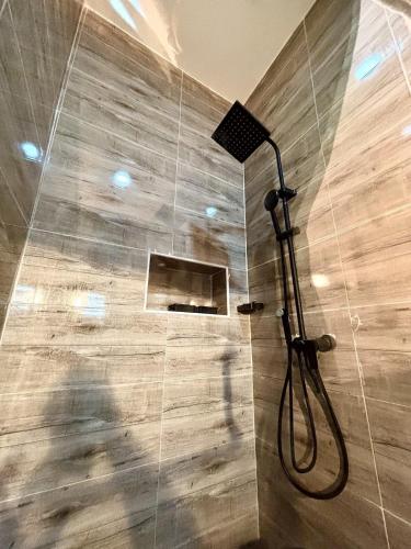 a shower in a bathroom with a glass wall at Modern getaway in Ajah in Lekki