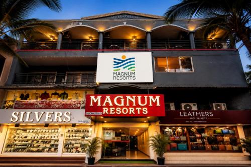 a store front of a building with signs at Magnum Resorts Candolim in Candolim