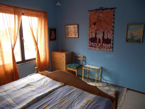 En eller flere senge i et værelse på Csilla Nyaraló