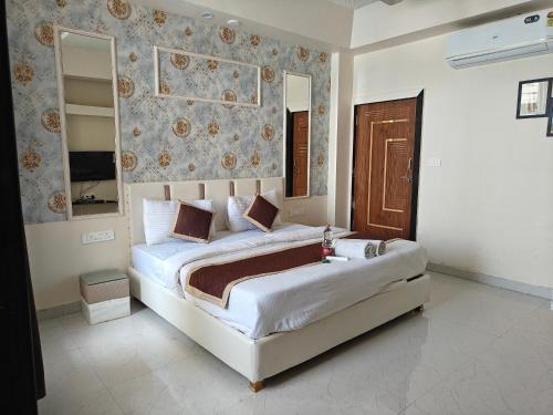 a bedroom with a large bed in a room at The Heritage villa in Udaipur
