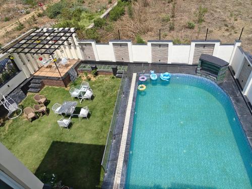 an overhead view of a swimming pool in a backyard at The Heritage villa in Udaipur