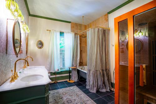 a bathroom with a tub and a sink and a shower at Cozy House with Private Sauna in Maryville