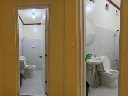 a bathroom with two toilets and a sink at Kubo Inn & Beach Camp in El Nido