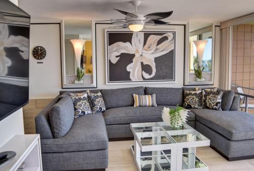 a living room with a couch and a ceiling fan at Mana Kai 711C in Wailea