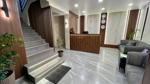 a lobby with a staircase and a waiting room at The Hill Guesthouse in Yerevan