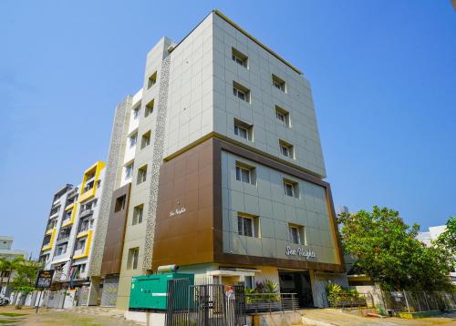 a tallartment building in a city at Open Hotel by Olive - Sea Heights in Kākināda