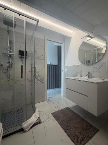 a bathroom with a shower and a sink at Capitani Guest House in Fiumicino